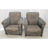 PAIR OF 1930s ARMCHAIRS with wide armrests, covered in a blue ground fabric, standing on stout block