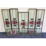 SEVEN DOUBLE GLAZED WINDOW PANELS each with a leaded stained glass design in the Glasgow style, of