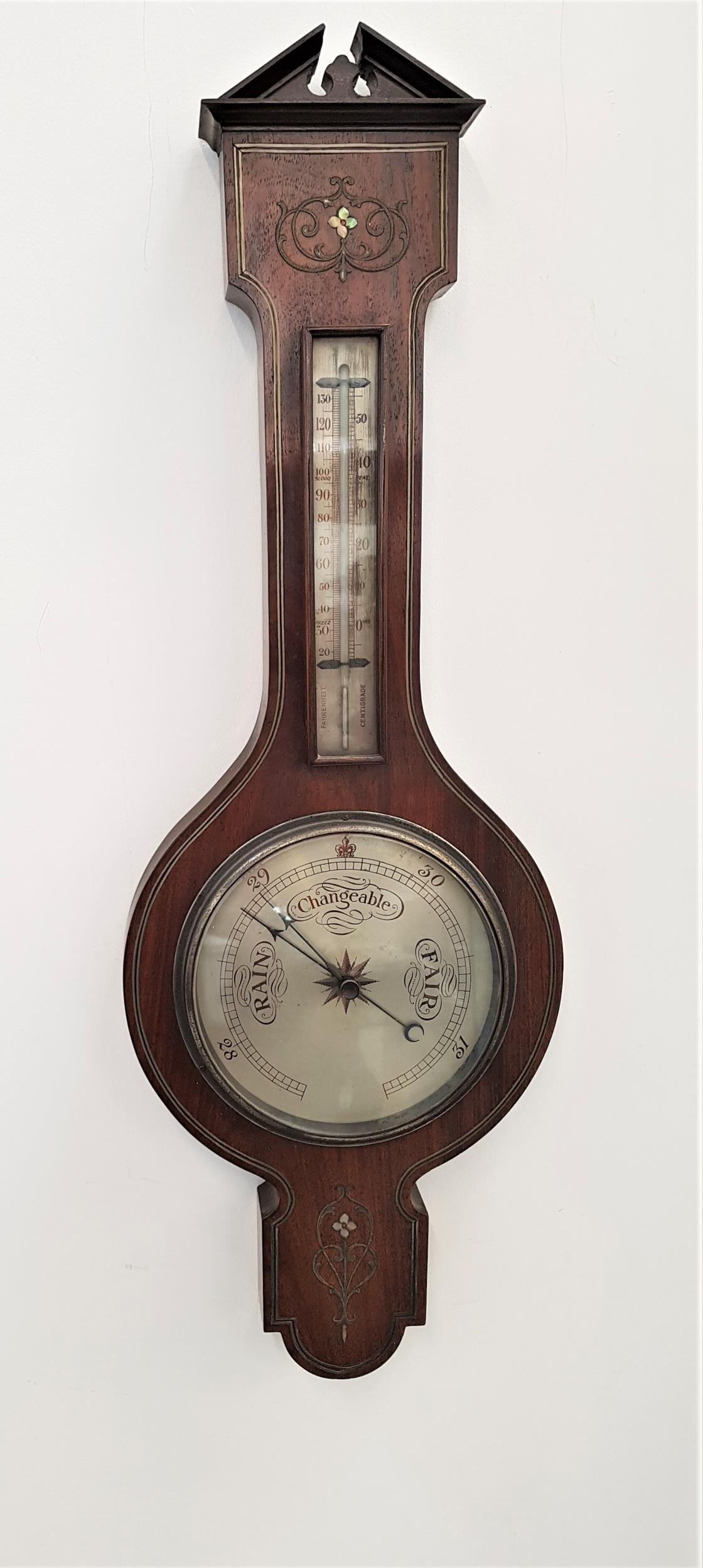 VICTORIAN ROSEWOOD BAROMETER with inlaid decoration, the broken architectual pediment above a