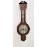 VICTORIAN ROSEWOOD BAROMETER with inlaid decoration, the broken architectual pediment above a