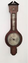 VICTORIAN ROSEWOOD BAROMETER with inlaid decoration, the broken architectual pediment above a