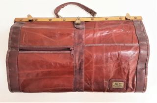 MARC CHANTAL LEATHER GLADSTONE TYPE BAG with a carry handle and brass fitting and locks, a leather