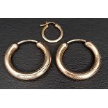 PAIR OF NINE CARAT GOLD HOOP EARRINGS with engraved decoration, together with a small single nine