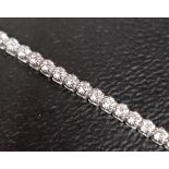 DIAMOND TENNIS BRACELET the diamonds totalling approxiamtely 1.3cts, in eighteen carat white gold,