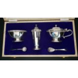 ELIZABETH II CASED SILVER CRUET SET comprising a pepper pot, lidded mustard bowl with spoon and blue