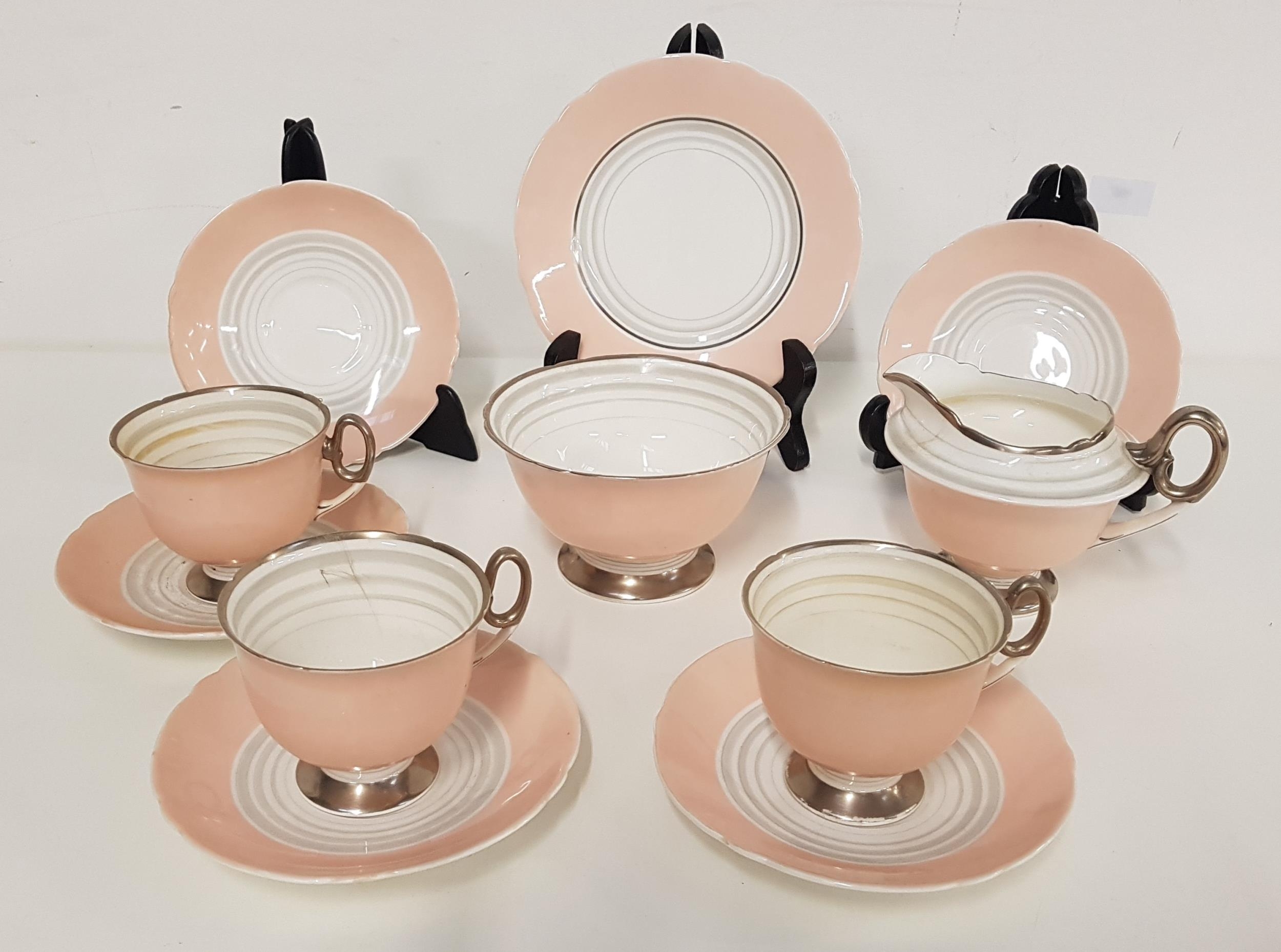 SHELLEY TEA SERVICE with a pale pink and white ground with silver highlights, comprising six cups