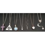 SELECTION OF SILVER PENDANTS ON CHAINS including an amethyst cross, circular moonstone and CZ set