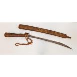 NORTH INDIAN OR NEPALESE SWORD with a 56.5cm long blade with a carved wood grip decorated with small