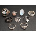 SELECTION OF NINE SILVER RINGS including a large dress ring with mystic topaz style stone, a large