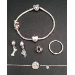 SELECTION OF PANDORA JEWELLERY comprising a silver Pandora Moments Family Tree heart clasp bracelet,