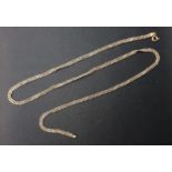 EIGHTEEN CARAT TWO TONE WHITE AND YELLOW GOLD THREE STRAND NECK CHAIN comprising two white gold