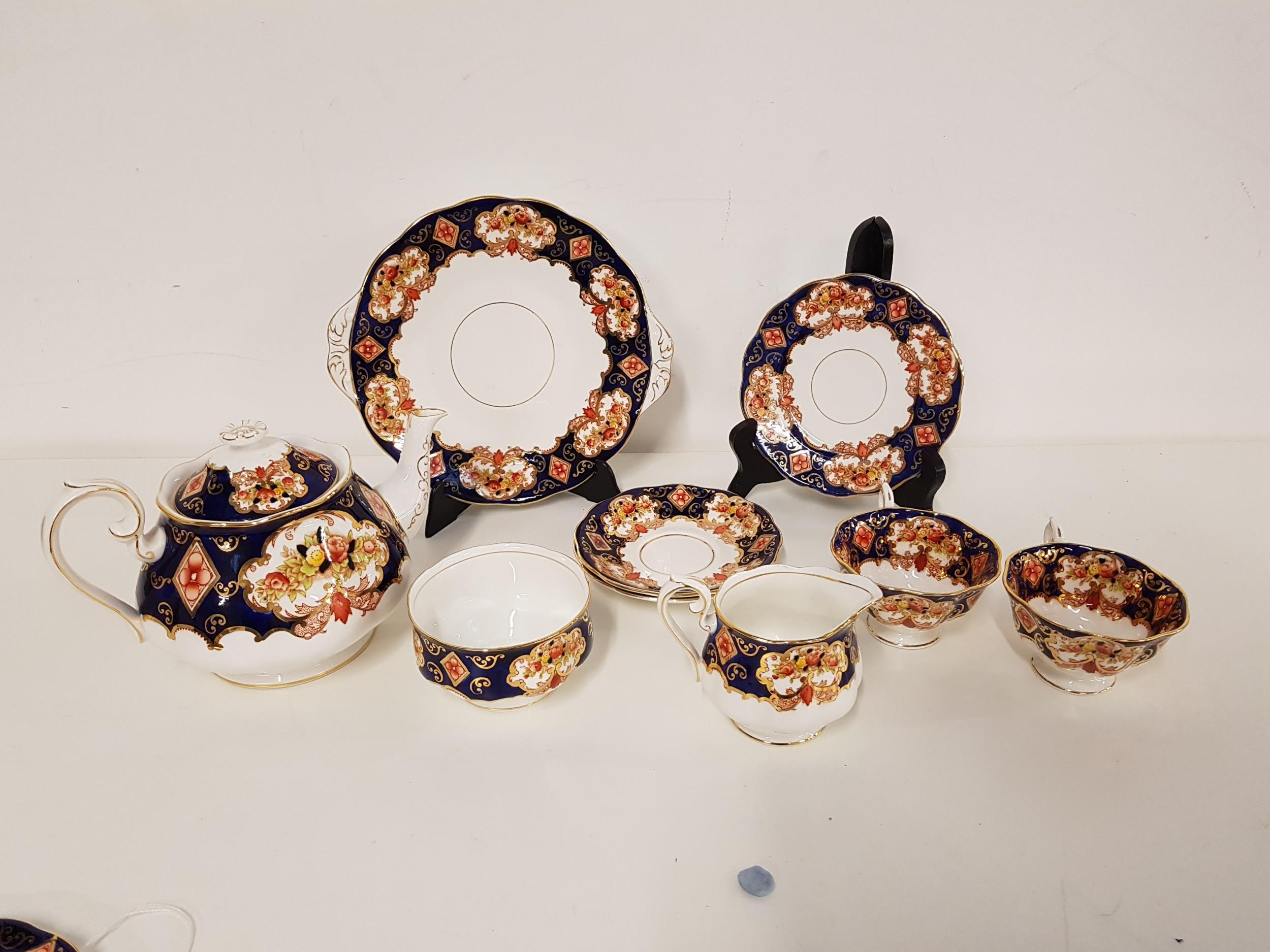 ROYAL ALBERT HEIRLOOM TEA SERVICE comprising a lidded tea pot, five cups, six saucers, six side