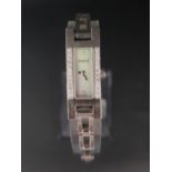 LADIES GUCCI WATCH with diamonds flanking the rectangular mother-of-pearl face, with further
