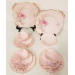 TEN PIECE TUSCAN BONE CHINA TEA SET with a lily design on a pink ground with gilt highlights,