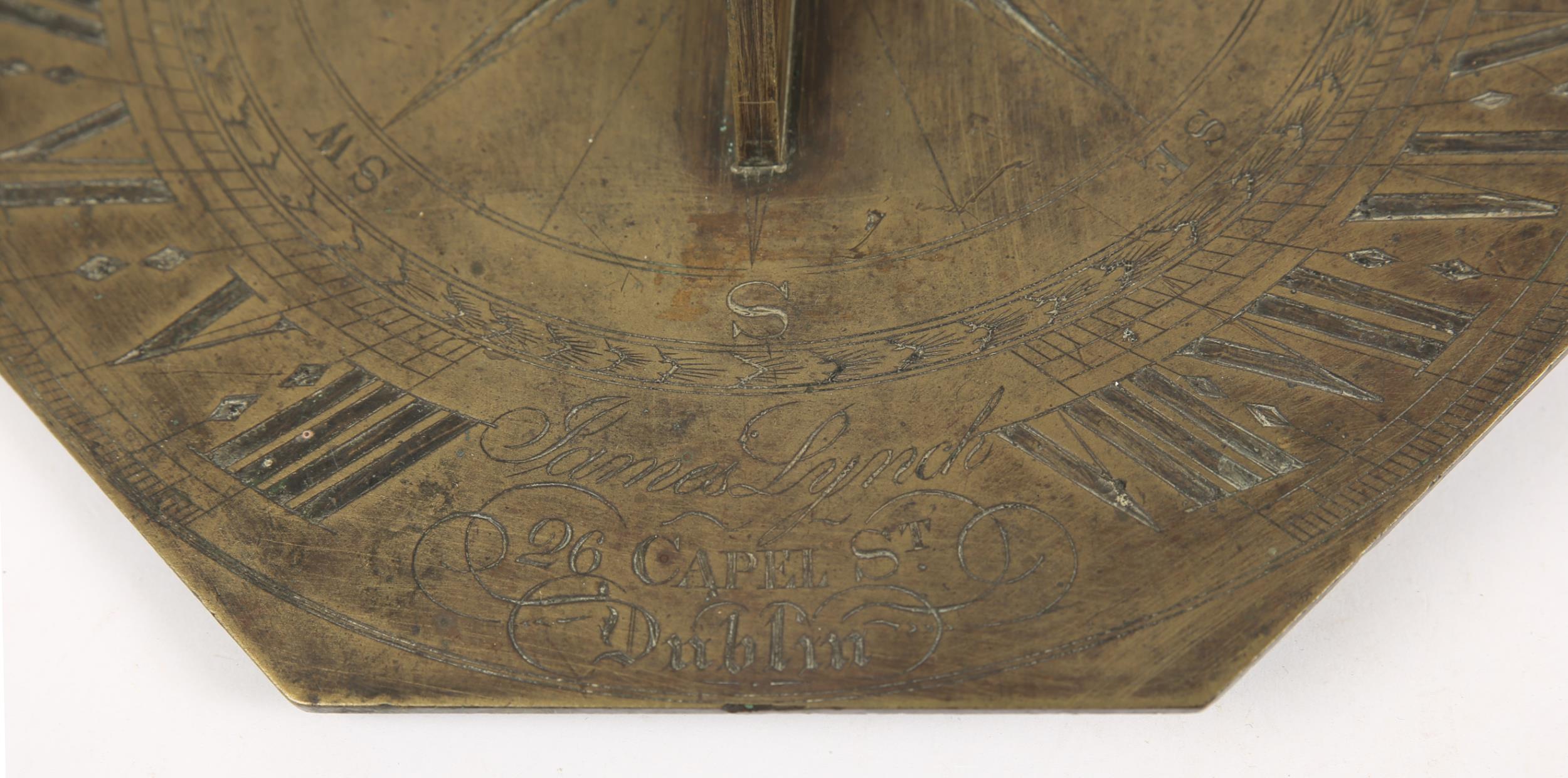 An early 19th century brass octagonal sundial, the scrolled gnomon centred on a finely engraved - Bild 2 aus 2