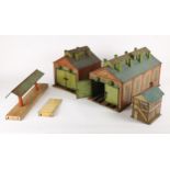 Hornby O Gauge lineside buildings. No. 1 engine shed, aged and play-worn; E2 engine shed, fully