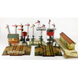 Hornby O Gauge lineside items, No. 1 level crossing, 1930, green posts, play-worn (2); No. 2 black