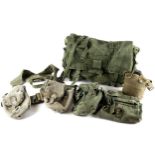 A collection of American military issue webbing and equipment, including a haversack, water