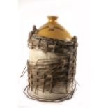 Powers Whiskey stoneware five-gallon whiskey jar in wicker basket, numbered A166.