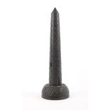 A carved bog oak round tower, on domed base, 8¼" (21cm) high.