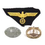 Kriegsmarine U-Boat Badge (gilt). A U-Boat within an oval oak-leaf wreath surmounted by an eagle and