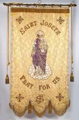 A 19th century processional banner venerating St. Joseph. A gilt brocade banner enclosed by a silver