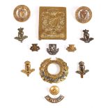 Royal Irish Regiment small collection of badges and buttons, including a cross belt plate, cap