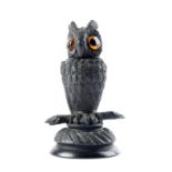 A Victorian bog oak vesta in the form of a long-eared owl, the head with amber glass eyes, lifting