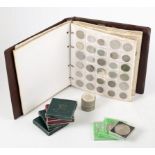 An accumulation of commemorative coins and an album of miscellaneous coins.