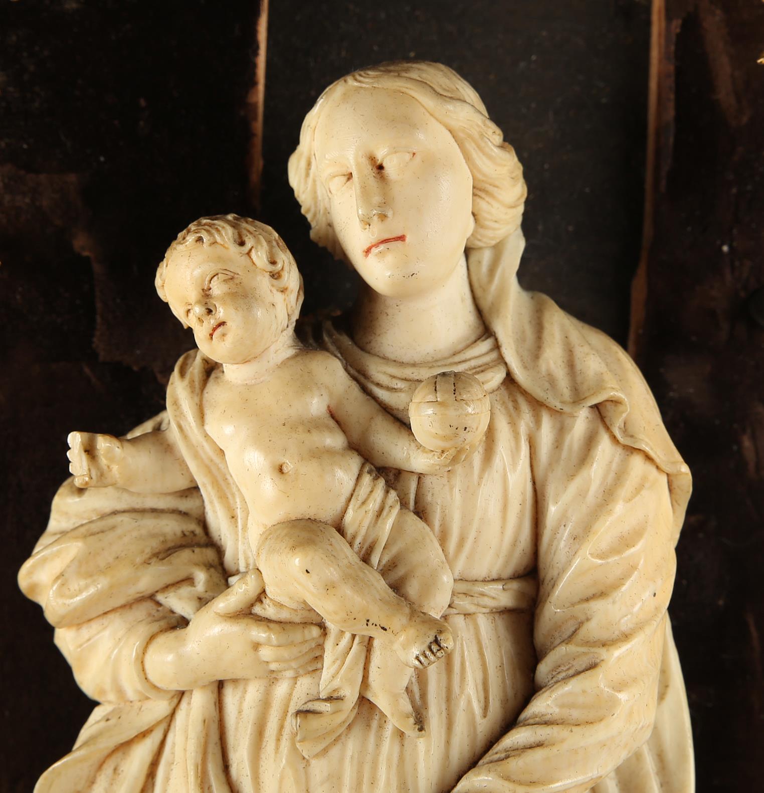 18th century, Dieppe school, fine carved ivory Madonna and Child with putti, 9" (23cm) tall, mounted