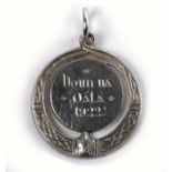 1922 Bonn na Dála or Dáil Medal. An Irish silver Celtic-revival style medal, a torc shaped border