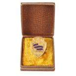 Long service award. A 9ct gold shield-shaped lapel badge, "For - Long Service - L.B. Ld.",