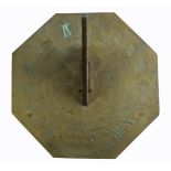 An early 19th century brass octagonal sundial, the gnomon centred on a finely engraved compass