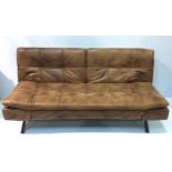 A contemporary brown leather sofa bed, with drop-ends and back, raised on black metal frame, 187cm