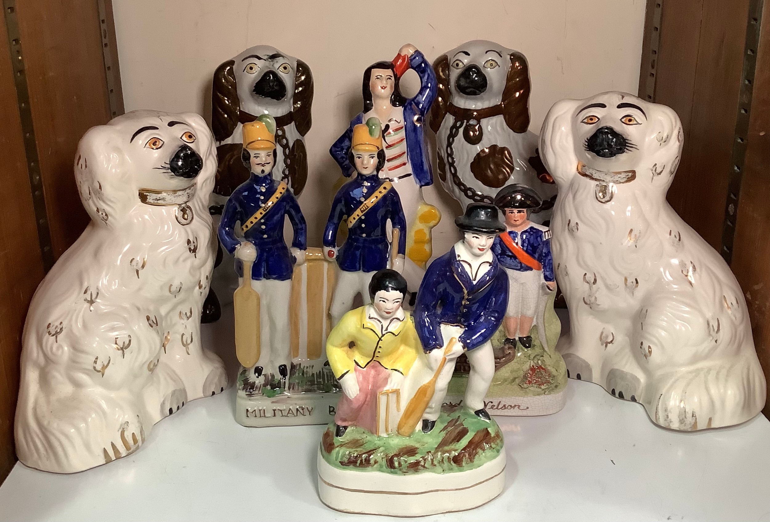 SECTION 25. Four various Staffordshire pottery figures including 'Military Batsman', 'Jack Tar'