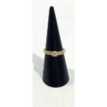 An 18ct gold and diamond ring, centrally four claw set with a round brilliant cut diamond,