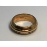 An 18ct gold three row band with canted sides, marked '750', 13.1g, ring size Q