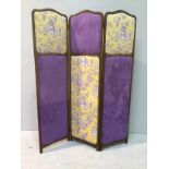 A three-fold dressing screen with mahogany frame and mauve and yellow chinoiserie fabric