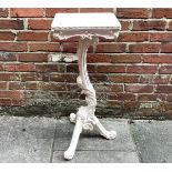 A 19th century carved and white painted Italian style torchere stand, with rectangular top, raised