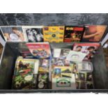 A large mixed lot including vinyl 45s and collectable cards, stickers, badges and stamps of sport,