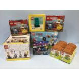 A cased set of 36 Lego Looney Tunes mini figures, together with Lego Adventure Time No. 21308,