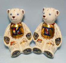 A pair of Royal Crown Derby Alphabet Bears, 'T' and 'K', with printed marks to base, gold stoppers