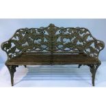 A 19th century Coalbrookdale style cast iron garden bench, painted green and black in the Fern and