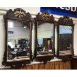 Three reproduction Georgian fret carved mahogany rectangular wall mirrors with eagle pediments (