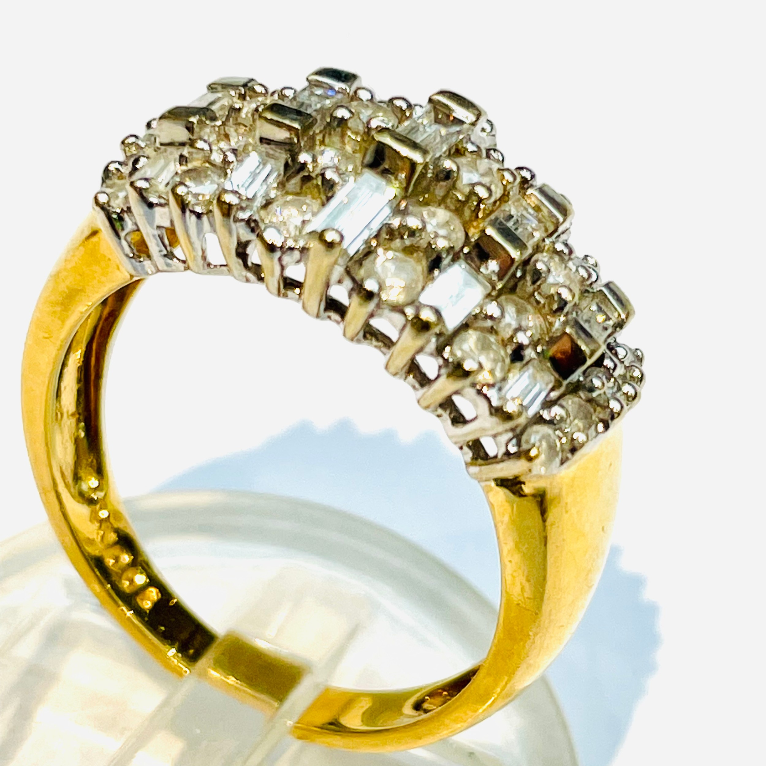 An 18ct yellow gold diamond dress ring, set with 28 x round brilliant cut diamonds and 15 baguette - Image 3 of 3