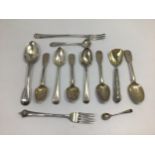 A quantity of Georgian and later silver teaspoons and a pickle fork, approx. 6.98 ozt