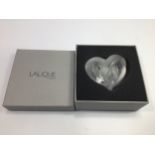 A 20th century Lalique opalescent crystal heart shaped paperweight 'Coeurs Entrelaces' formed as