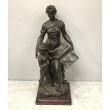 A large bronzed spelter figure 'Goddess & Child' the Goddess holding a book with page open on 'Un