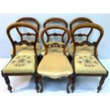 A matched harlequin set of six Victorian walnut balloon back standard chairs, comprising a set of