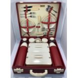 A Brexton for Harrods vintage picnic hamper, in red vinyl covered case, complete contents other than